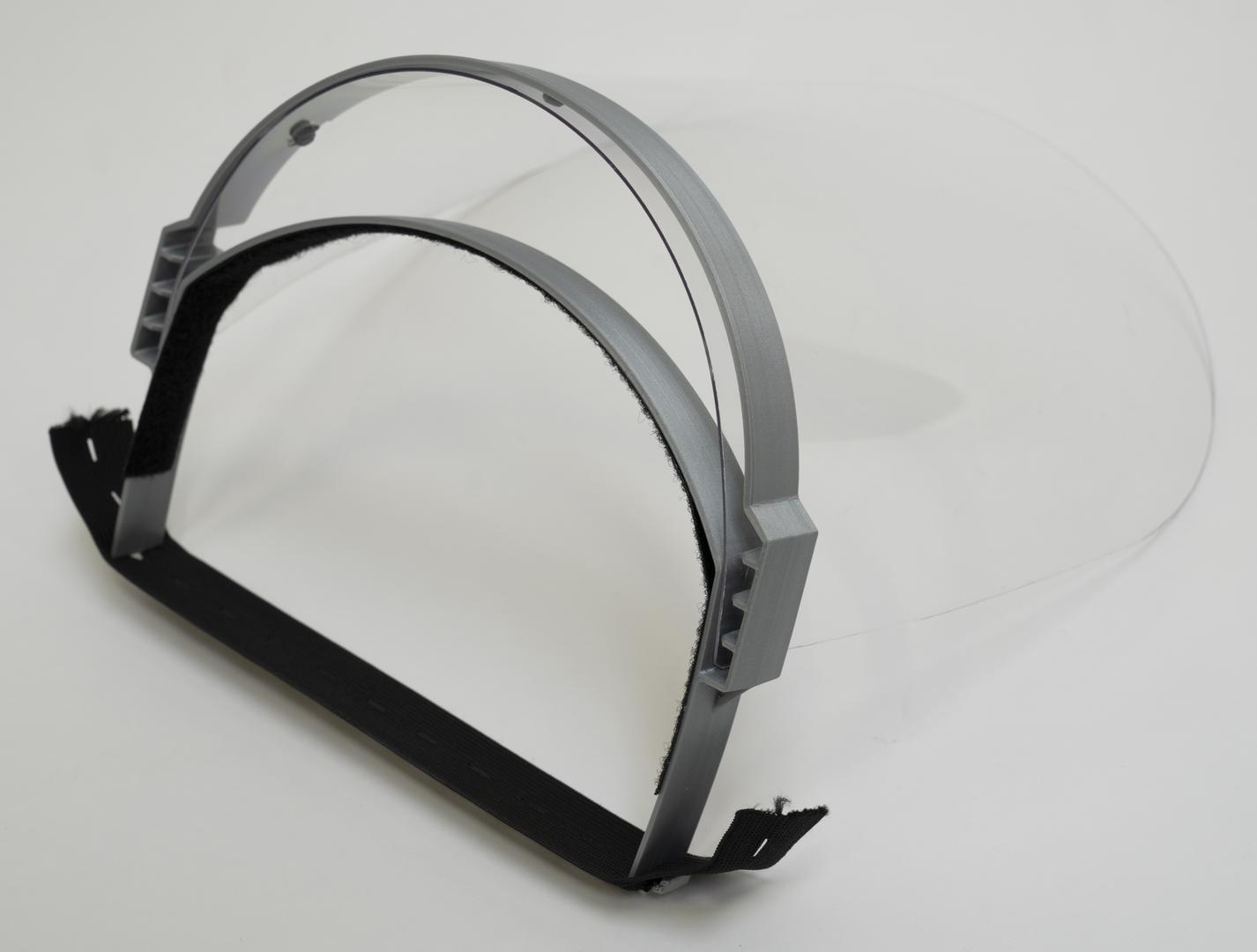 Assembled face protection shield with black frame and clear visor